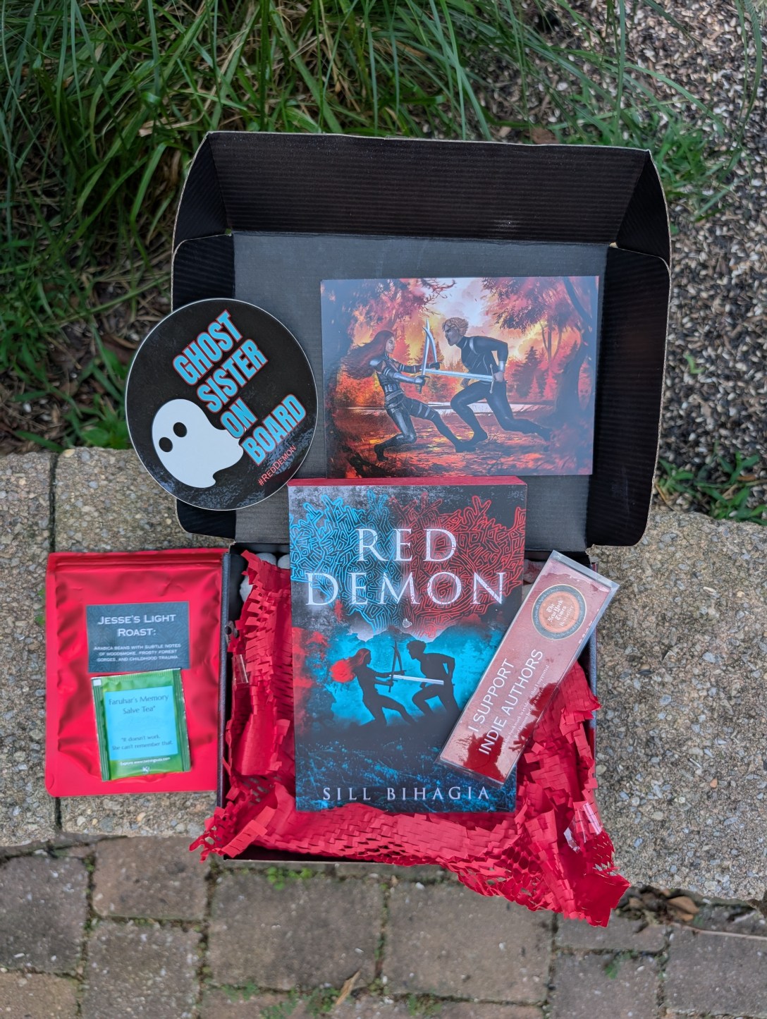 An ARC package of Red Demon sits on a wall