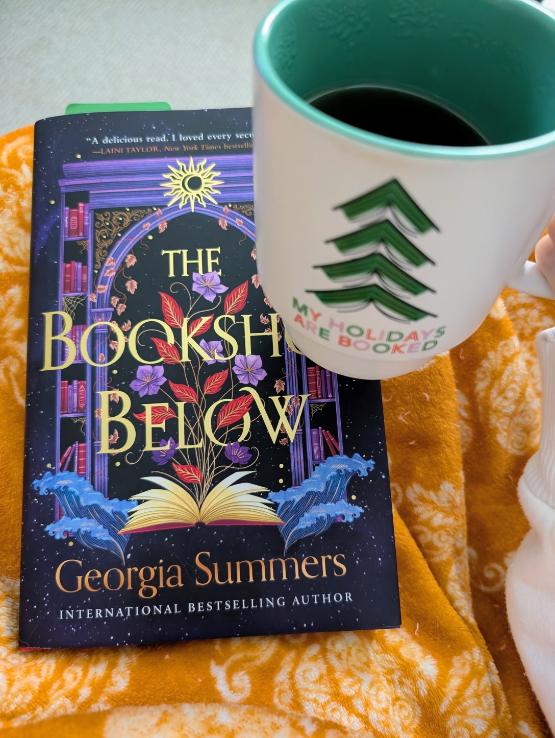 The Bookshop Below with a holiday mug